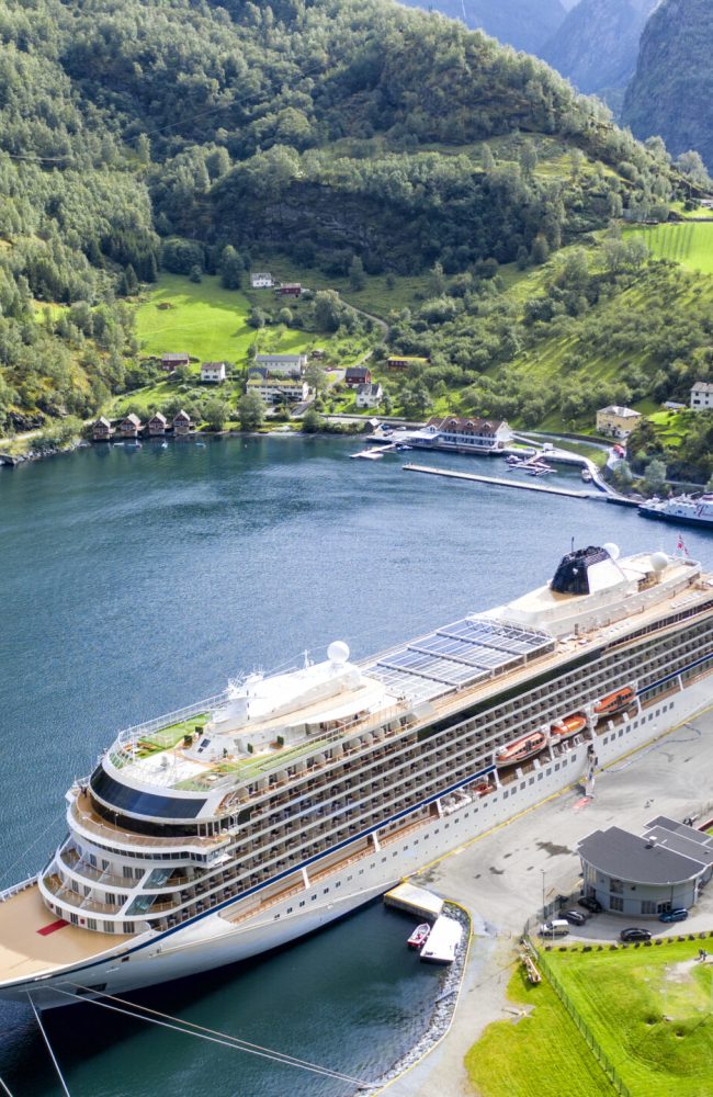 Big passenger ship in a bay. Picturesque, beautiful bay with a cruise ship.