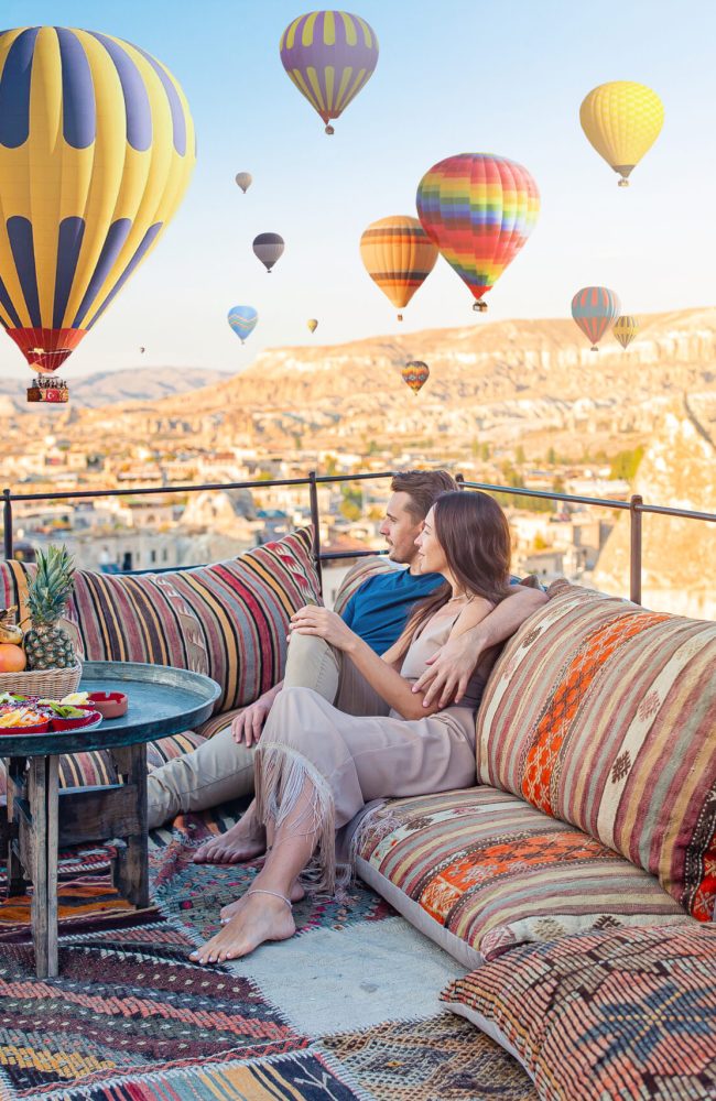 Happy couple in Cappadocia. Couple travels the world. Hot air balloon flights.