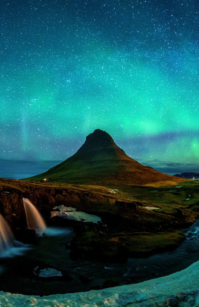 Northern Light, Aurora borealis at Kirkjufell in Iceland. Kirkjufell mountains in winter.