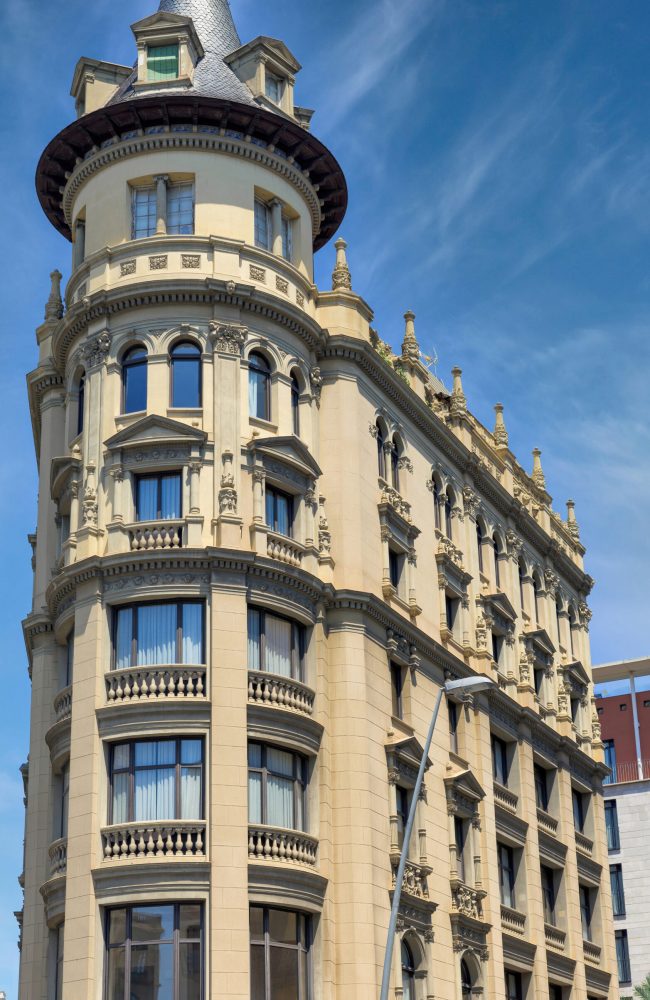 Old residential building at sunny day in Barcelona, Spain