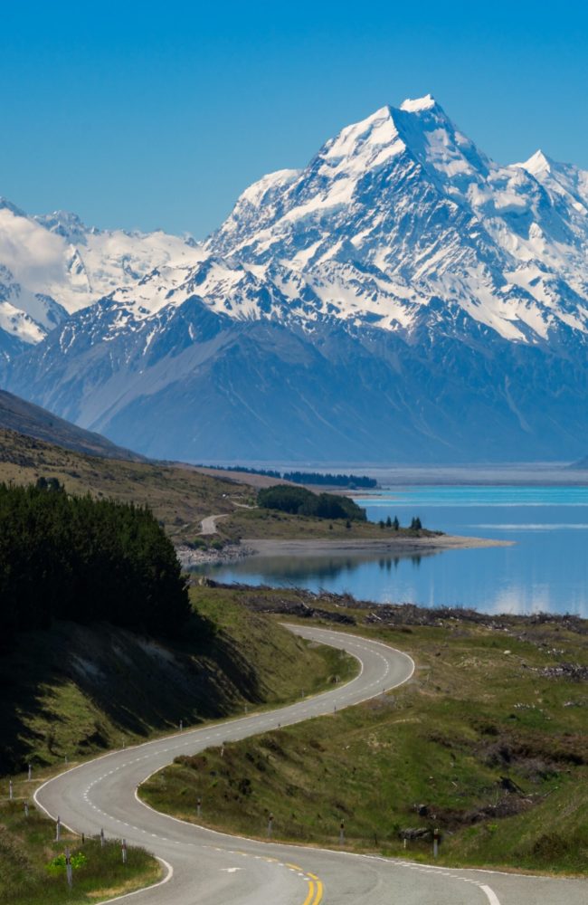 Road to Mount Cook, the highest mountain in New Zealand. A scenic highway drive along Lake Pukaki in Aoraki Mount Cook National Park, South Island of New Zealand. Shot at Highway 80 (Mt Cook Road).
